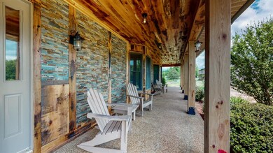 Large Covered Front Porch Boasts New Veneer of Hal