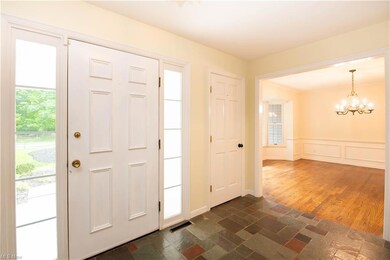 Entryway featuring dark tile flooring