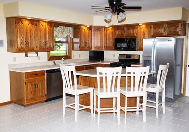 Kitchen includes custom Fehrenbacher cabinets, til