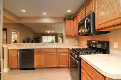 Wood Cabinets with New Upgraded Black Stainless Ap