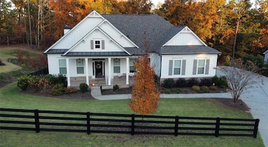 View of front of property in the Fall with board a