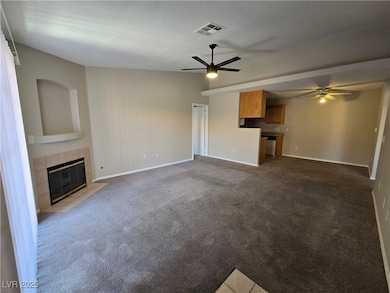 Unfurnished living room featuring a ceiling fan, a