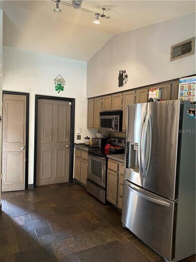 Kitchen view with pantry and 2 car Garage access