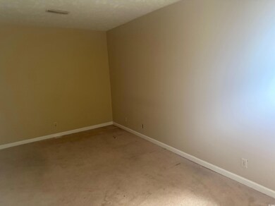Spare room featuring visible vents, light colored 