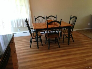 Dining area off kitchen is ample enough for larger table, also has a slider that leads to back yard.