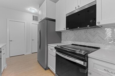 Kitchen featuring range with electric stovetop, l