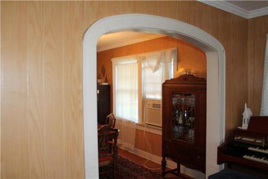 arch way seperating living room and dining room