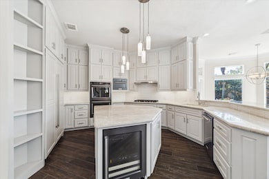 The kitchen is open to the family area, breakfast room and all the picture windows overlooking the pool.