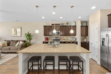 The center island doubles as a breakfast bar perfe