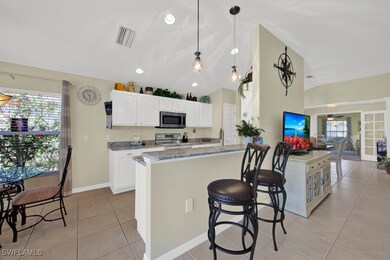 Kitchen with light tile patterned floors, light st