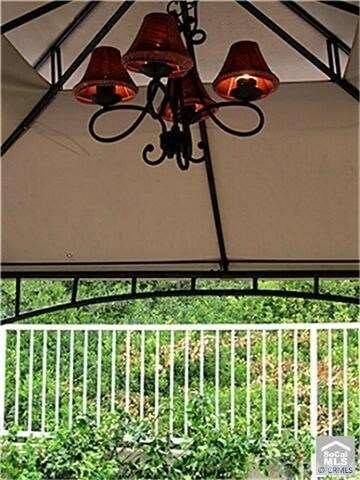 Outdoor living - Beautiful canopy with chandelier.