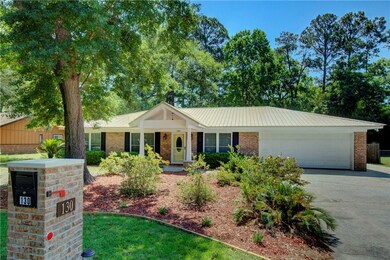 Notice the new metal roof, front porch and custom