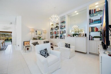 Sitting room with light tile patterned flooring, a