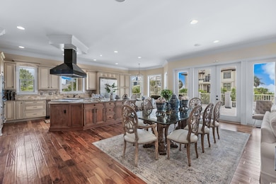 Dining room featuring crown molding and dark hardw