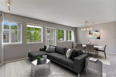 Living/Dining Room with attractive track lighting. All new Paint and Carpet.