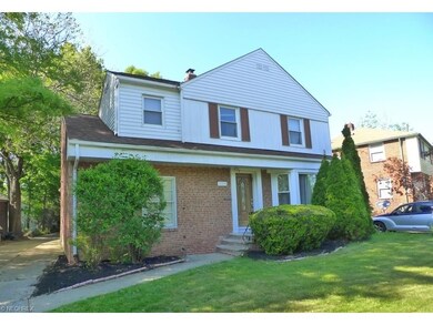 Front view of this delightful home with concrete d