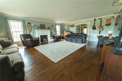 Large living room.  Wood floors, ventless log fire