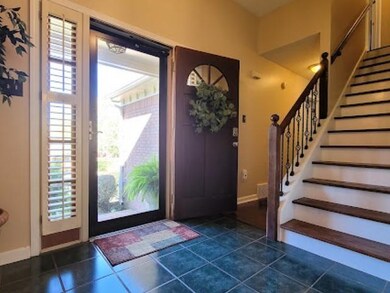 The spacious foyers opens to the formal dining roo