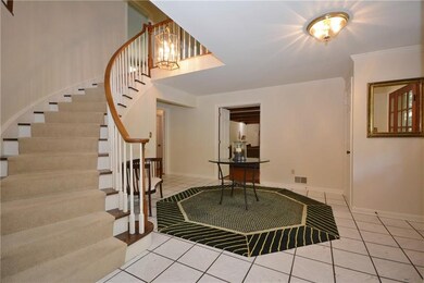 Wow - what a welcoming entry with spiral staircase