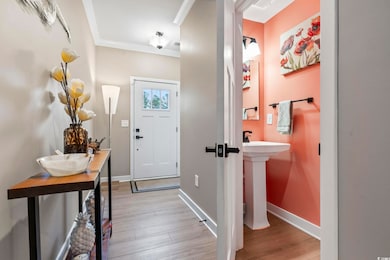 Entrance foyer with light hardwood / wood-style fl