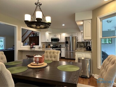 Spacious eat-in dining with bay window overlooking