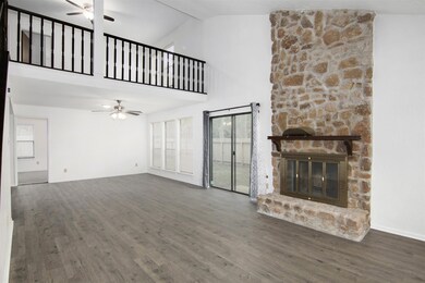 The living area is massive. Fireplace, patio doors