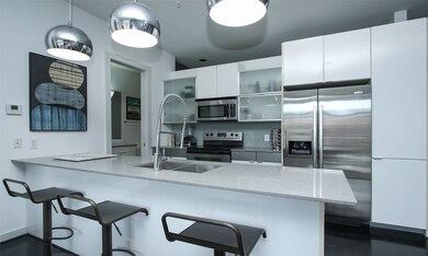 Glass mosaic tile backsplash and plenty of storage