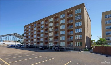 View of property with uncovered parking