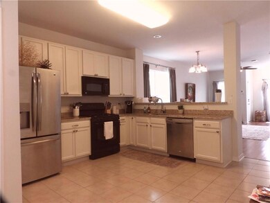 Roomy Kitchen with Granite Countertops and Stainless Steel Appliances