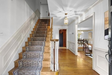 Lovely foyer showcasing the hardwood floors