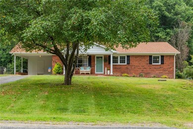 All brick, fresh exterior paint, new landscaping