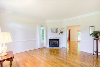 Living room with gas log fireplace.