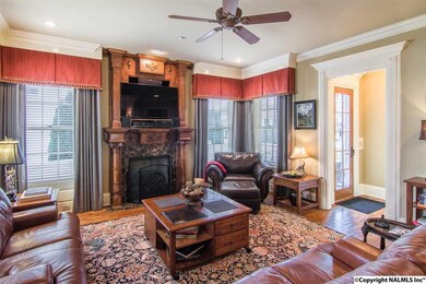 Sink down in the comfort of this amply sized family room with all the accoutrements of a classic 