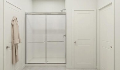 Primary bath with glass shower enclosure