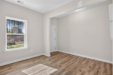 Spare room with light wood finished floors and baseboards