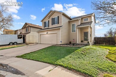 Traditional-style home with a garage and driveway