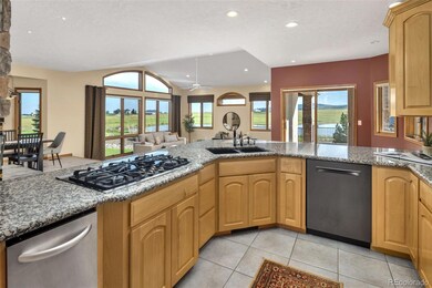 The Open Concept Living Room, Dining Area, and Kitchen Keeps the Space Airy and Naturally Lit. The Fully Equipped Kitchen Includes Gas Range, Dishwasher, Double Wall Oven, and Trash Compactor.