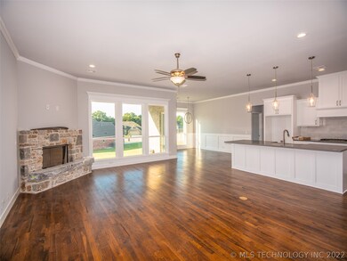 Spacious Living Room with cozy Fireplace is open t