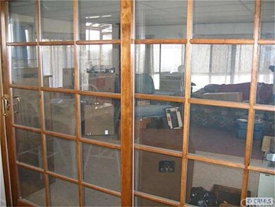 Doors Leading to Large Enclosed Patio