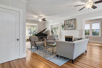 Formal Living Room with Original Fireplace and boasting fabulous Heart Pine Floors