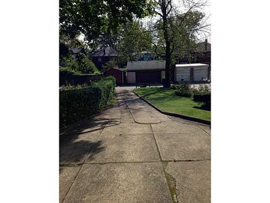 Exterior Back. Private Driveway