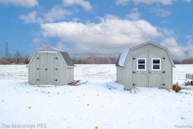 Snow covered structure with a storage unit