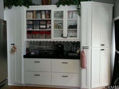 Wine rack with bar, pull out cupboards and pantry 