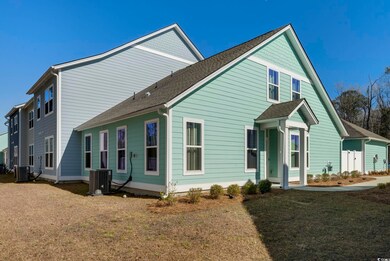 Exterior space with a yard and central AC