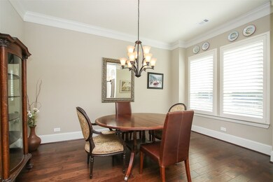 The formal dinning room is across from the study and is large enough for all your furniture.   Notice the plantation shutters.   The entire front of the home has plantation shutters.