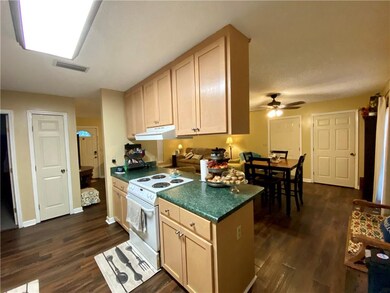 Kitchen features laminate countertops, Hood Vent,