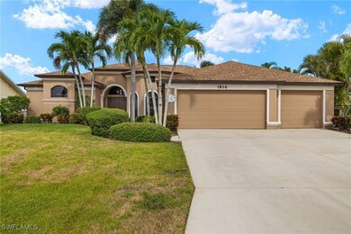 View of front of home with a garage, driveway, stu