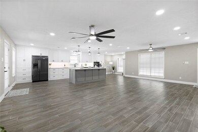 Kitchen with refrigerator with ice dispenser, a ce