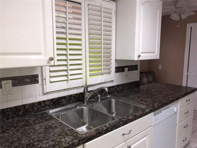 DELUX GRANITE OVER RAISED PANEL CABINETS. BRIGHT K
