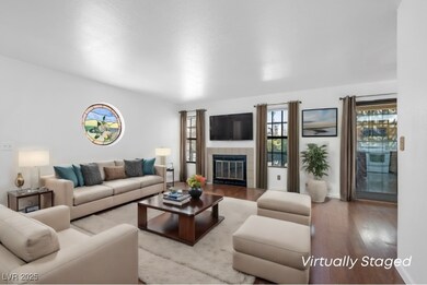 Living area with a tiled fireplace and wood finish